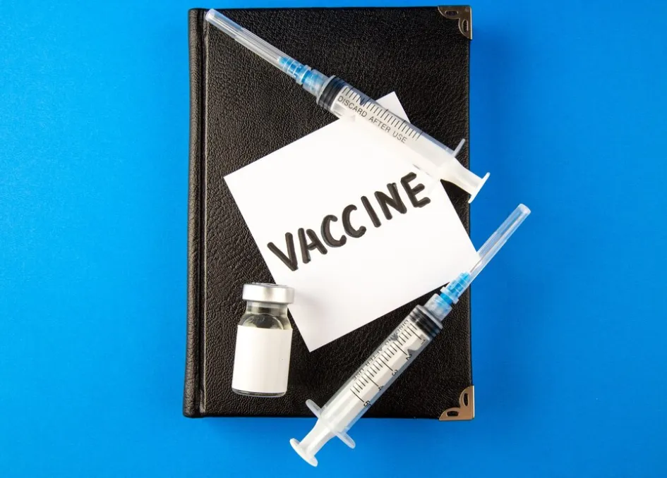 Vaccine vial, syringes, and immunization supplies arranged on a medical clipboard, representing vaccine availability and preventive healthcare products at a Jacksonville medical supply store.