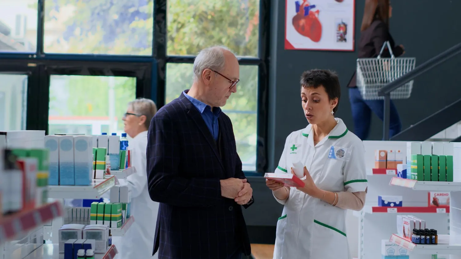 Pharmacist helping a customer select medical supplier in a pharmacy.