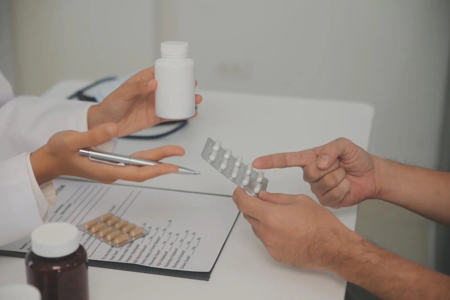 Pharmacist explaining generic medications to a patient at a drug store in Jacksonville.