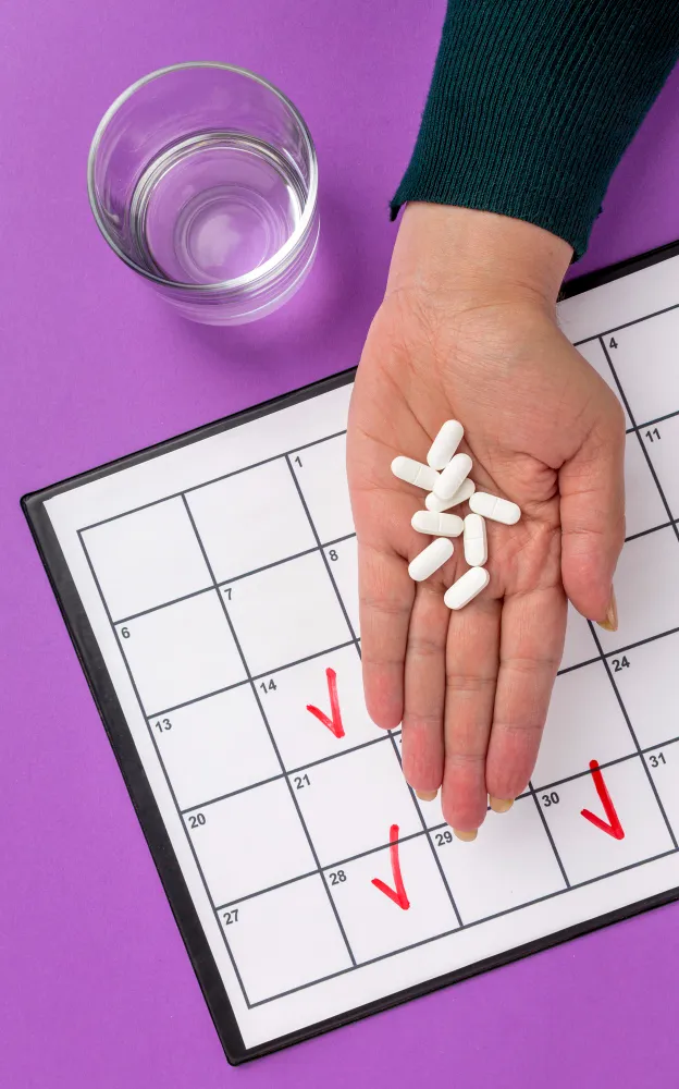 Person holding generic medications while following a medication schedule.
