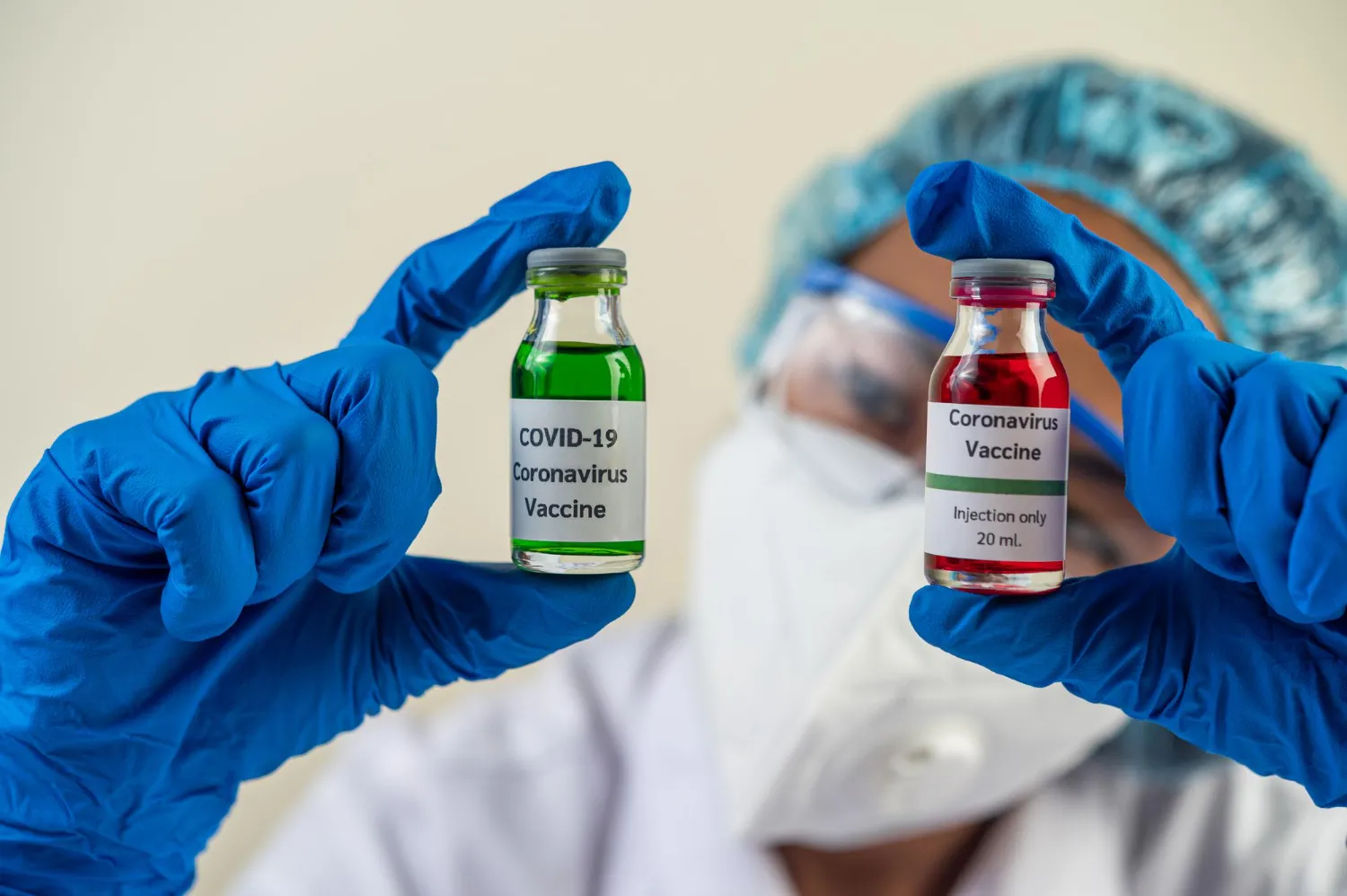 Healthcare professional holding COVID-19 vaccine vials, representing access to immunizations near me and the importance of following an immunization vaccine schedule for disease prevention