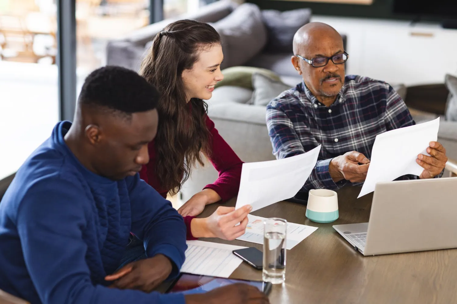 Patients reviewing prescription documents together for pharmacy medicine refill sync programs and prescription synchronization services