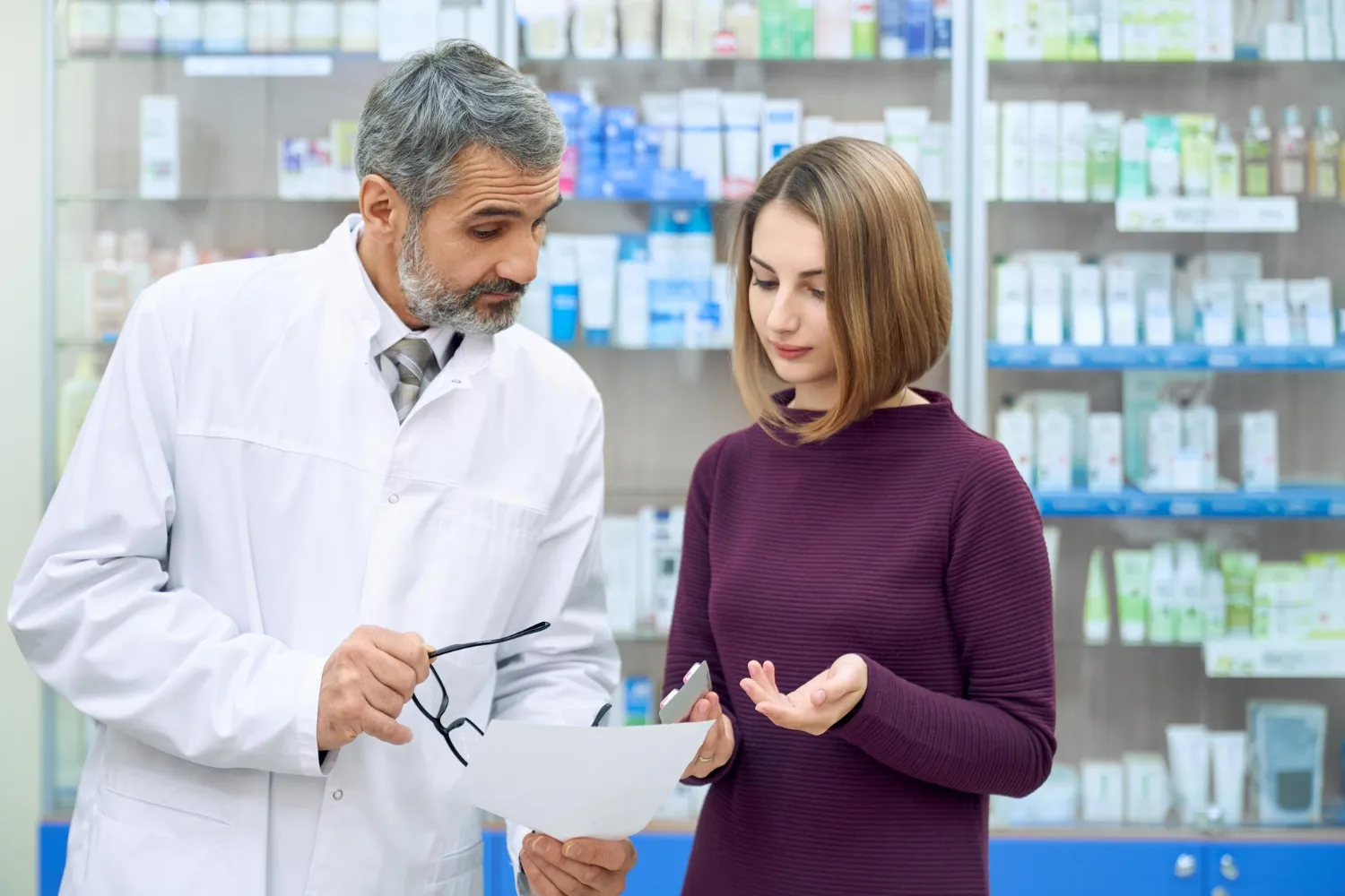 Pharmacist providing consultation and medication guidance to patient at a pharmacy in Jacksonville FL