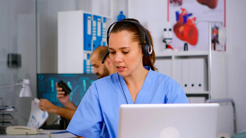 Healthcare staff managing patient support through digital systems, highlighting efficient service from a durable medical equipment store and reliable DME medical supply solutions