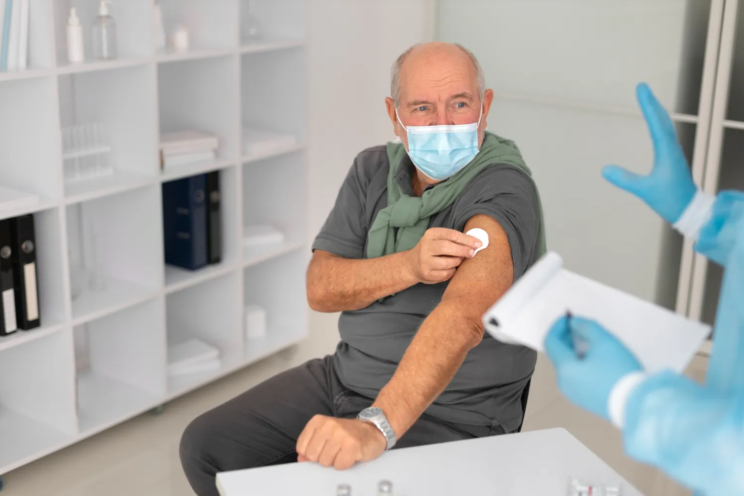 Senior patient after receiving a pharmacy vaccination during an adult immunizations near me appointment in Jacksonville.