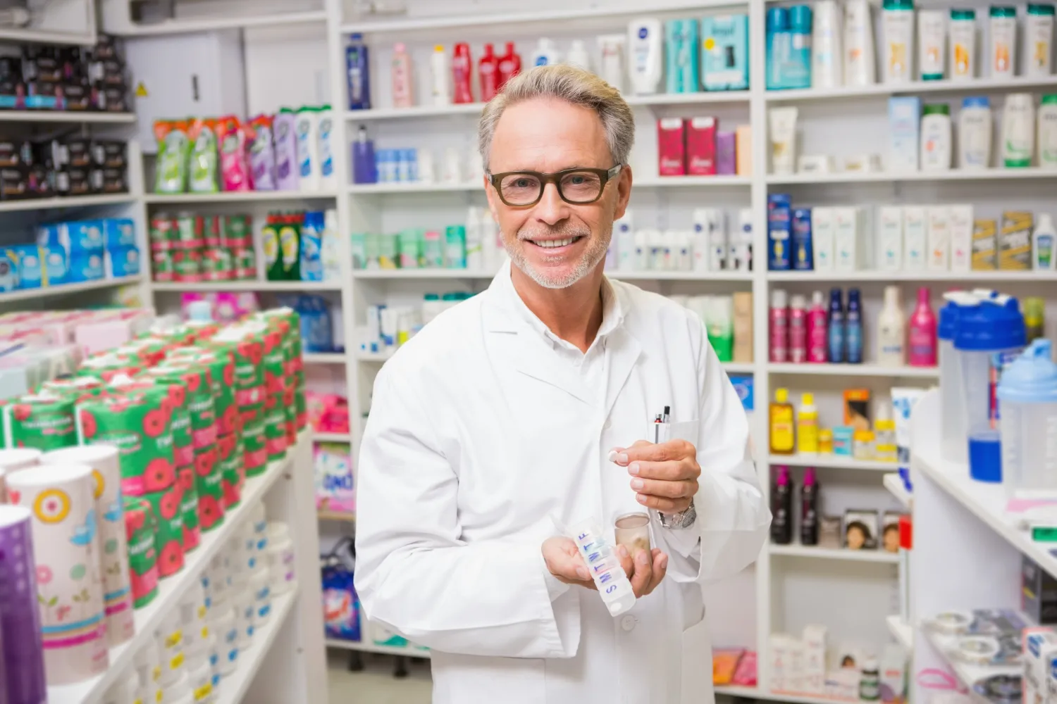 Pharmacist preparing vitamins and supplements at a Vitamin & Supplement Store.